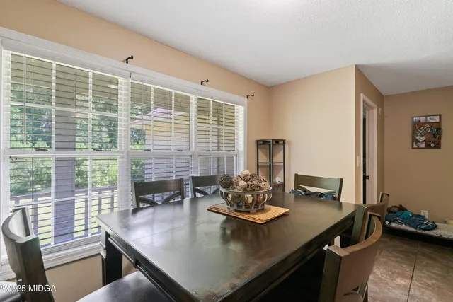 a view of a dining room and livingroom with furniture