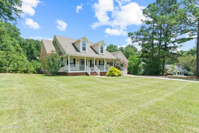 a view of a house with a big yard