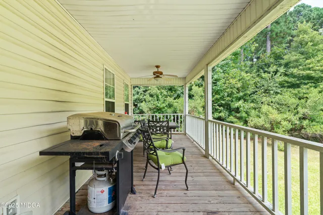 a view of a chairs and table on the balcony