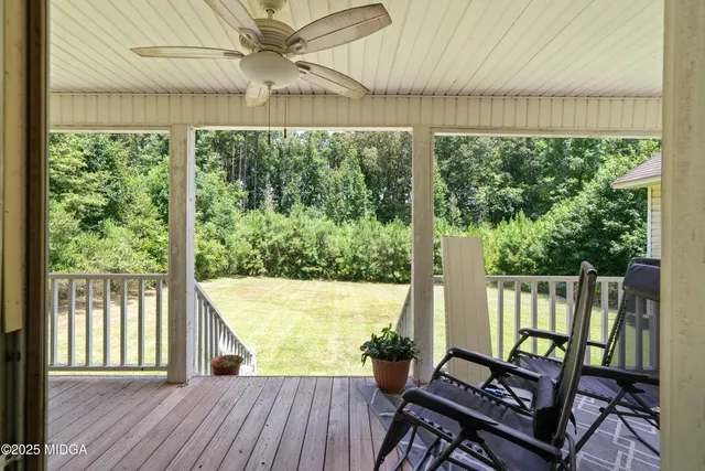 a view of a two chairs in the balcony