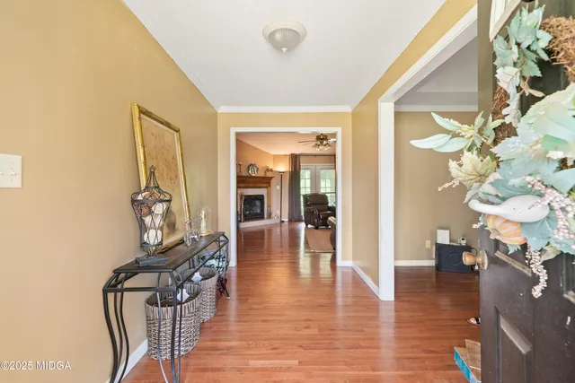 a view of a livingroom with furniture and hardwood floor