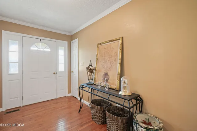 a room with furniture and wooden floor