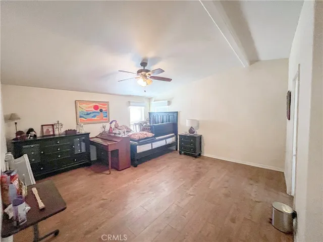 a bed room with furniture and a lamp