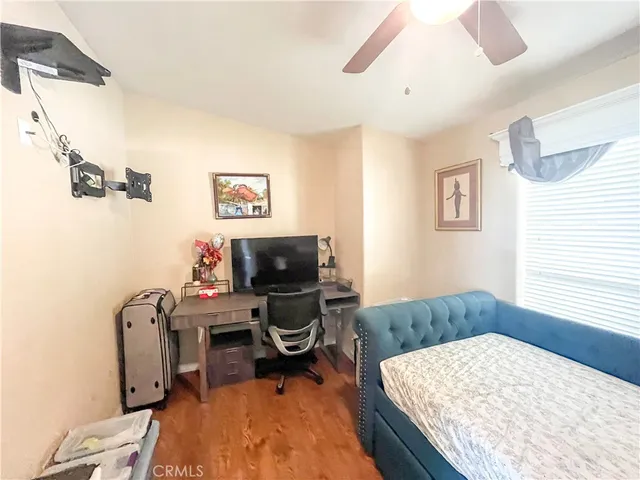 a bedroom with a workspace