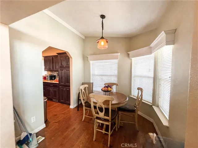 a dining room with furniture window wooden floor