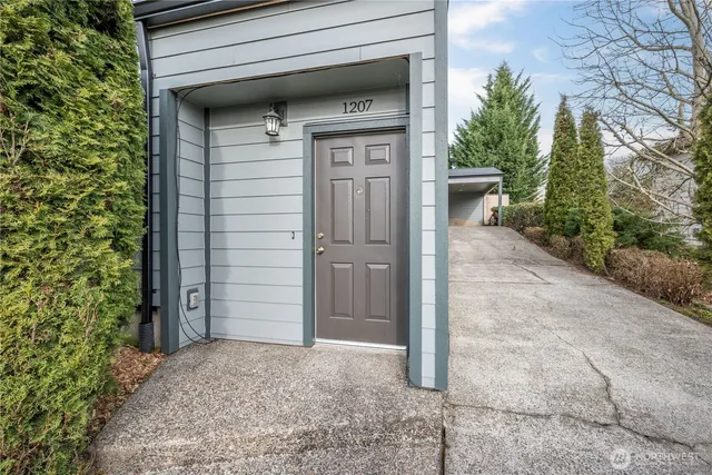 a view of empty room with wooden floor and cabinet