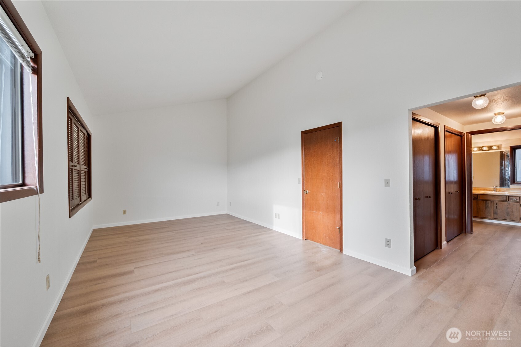 1205 Holly Street Kelso, WA 98626 - Photo 30 of 39 a view of an empty room with wooden floor and a window
