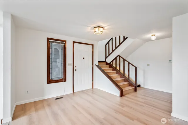 a view of entryway with wooden floor