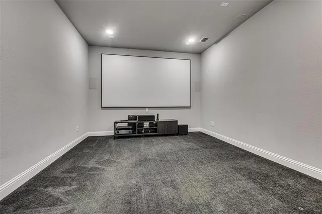 a bathroom with a granite countertop shower a toilet and a sink