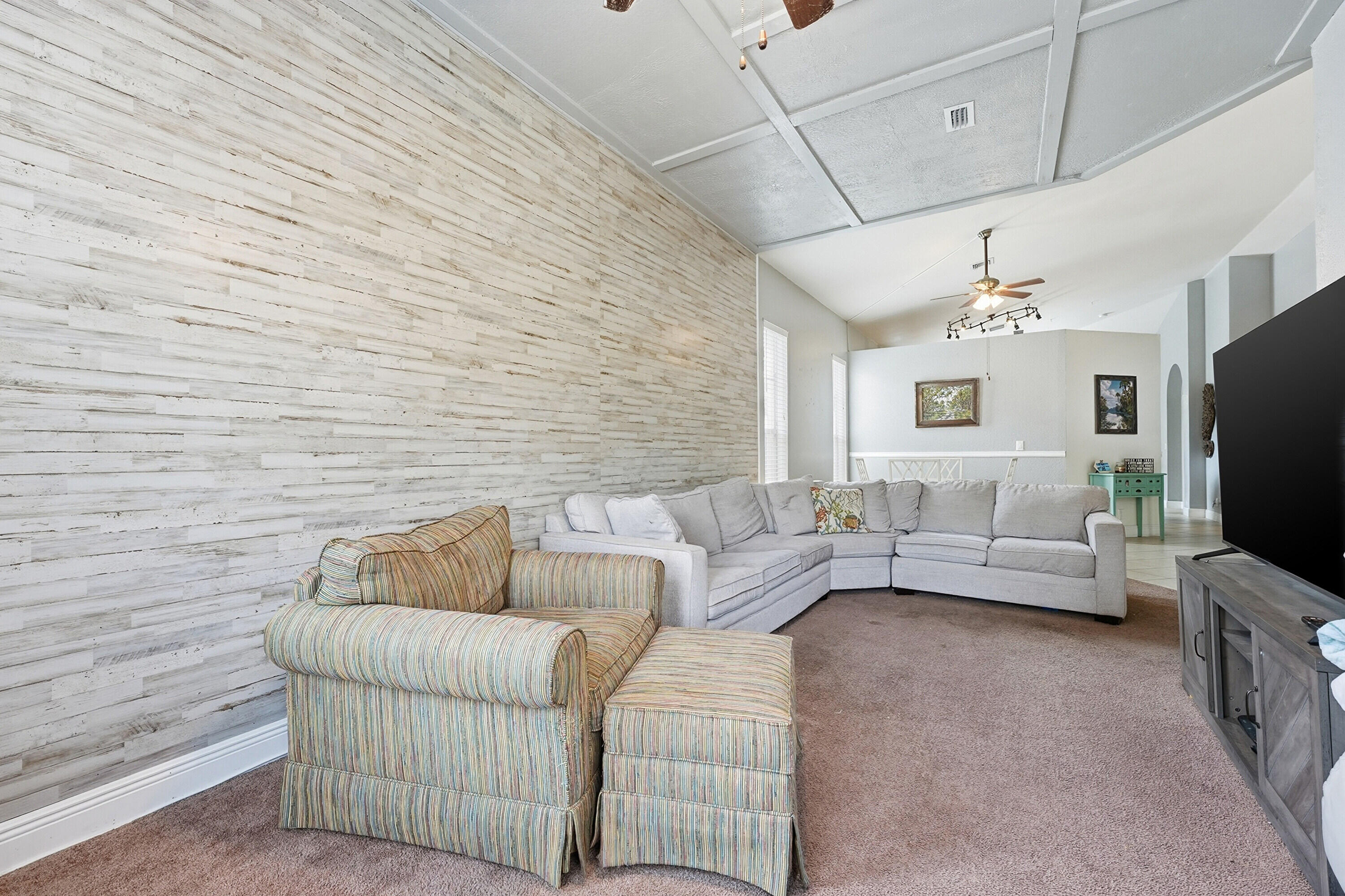 6117 Spring Lake Terrace Fort Pierce, FL 34951 - Photo 11 of 38 a living room with furniture and a flat screen tv