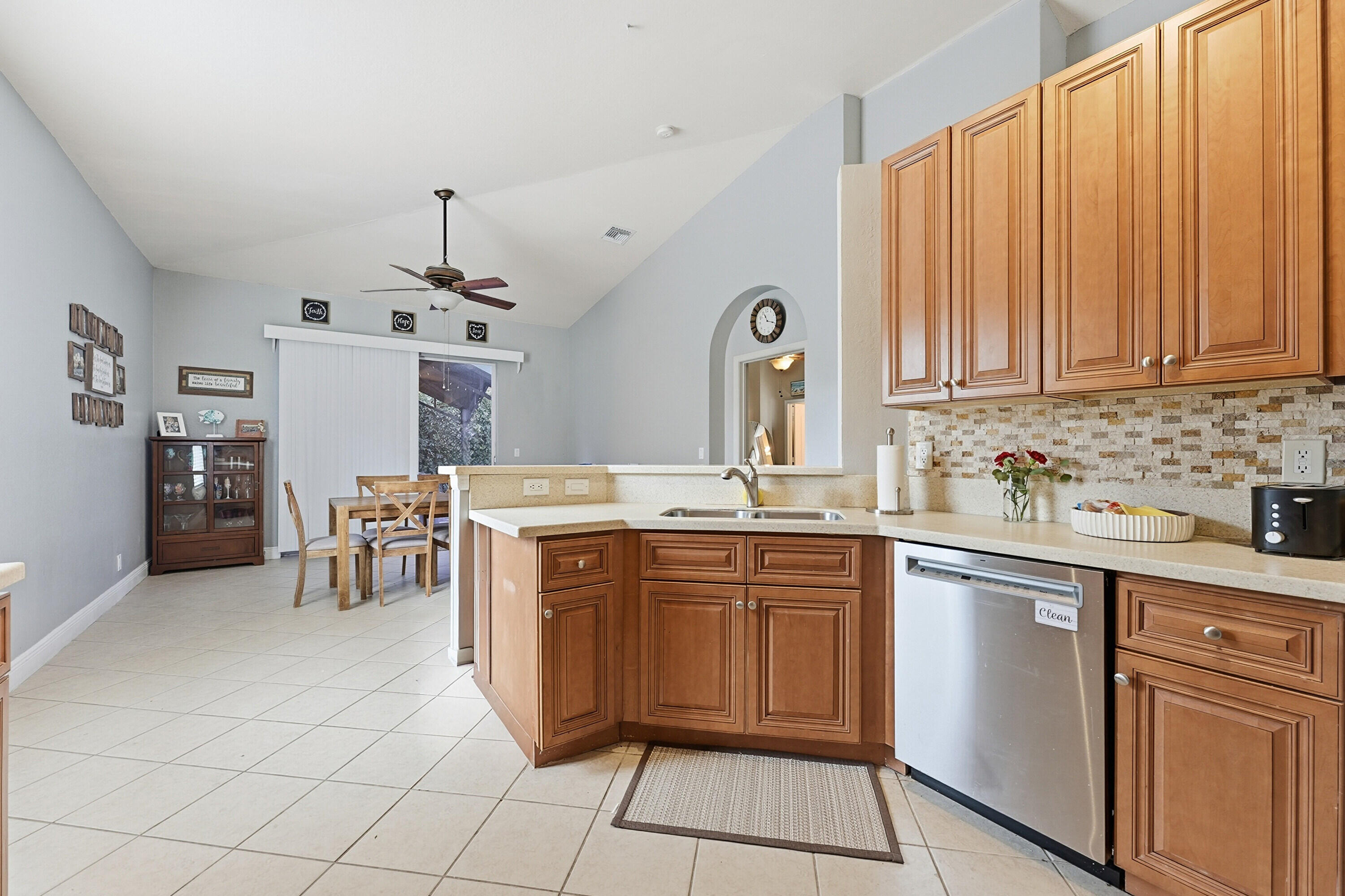6117 Spring Lake Terrace Fort Pierce, FL 34951 - Photo 15 of 38 a kitchen with stainless steel appliances granite countertop a sink and cabinets
