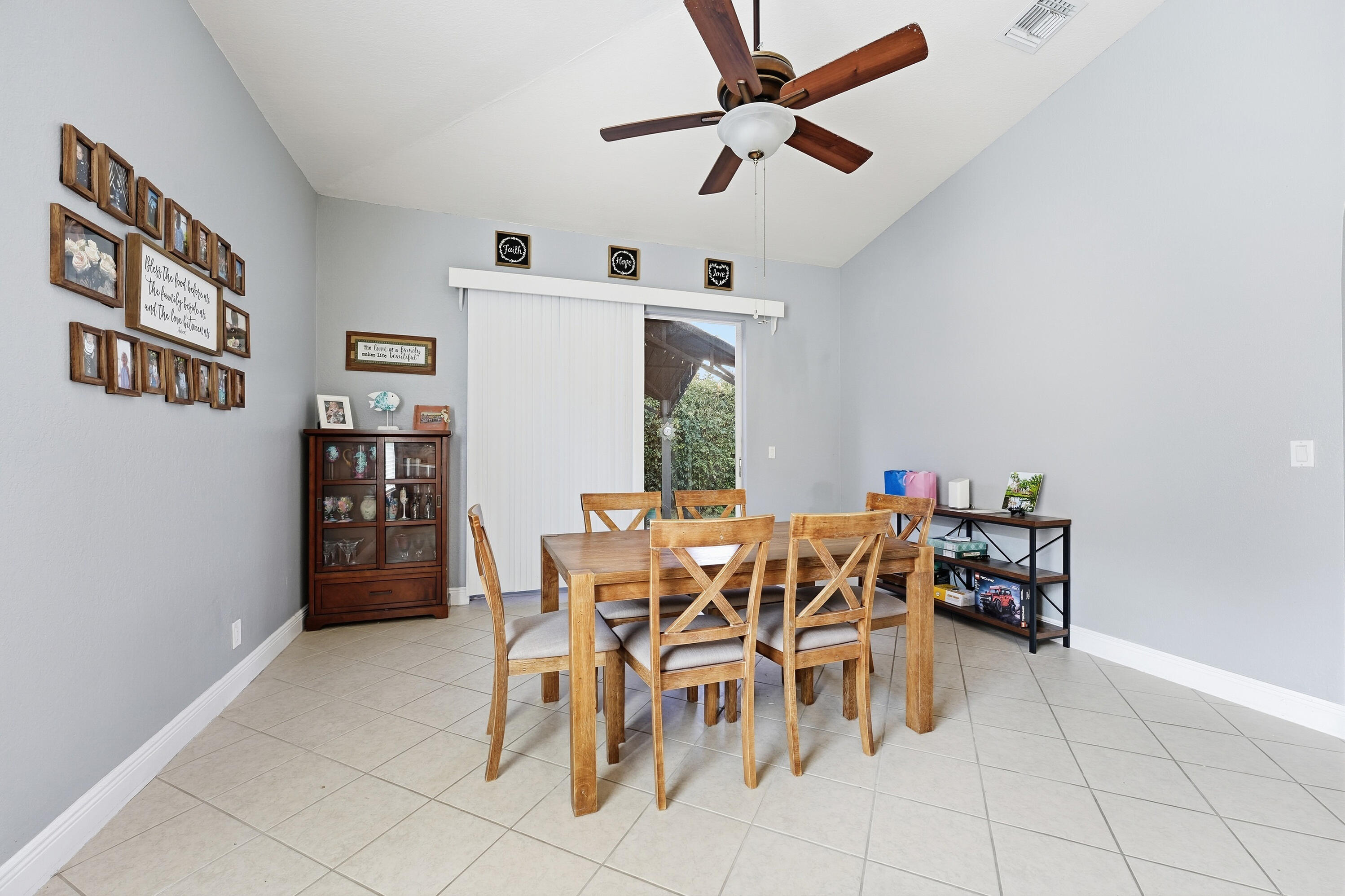 6117 Spring Lake Terrace Fort Pierce, FL 34951 - Photo 16 of 38 a dining room with furniture and window