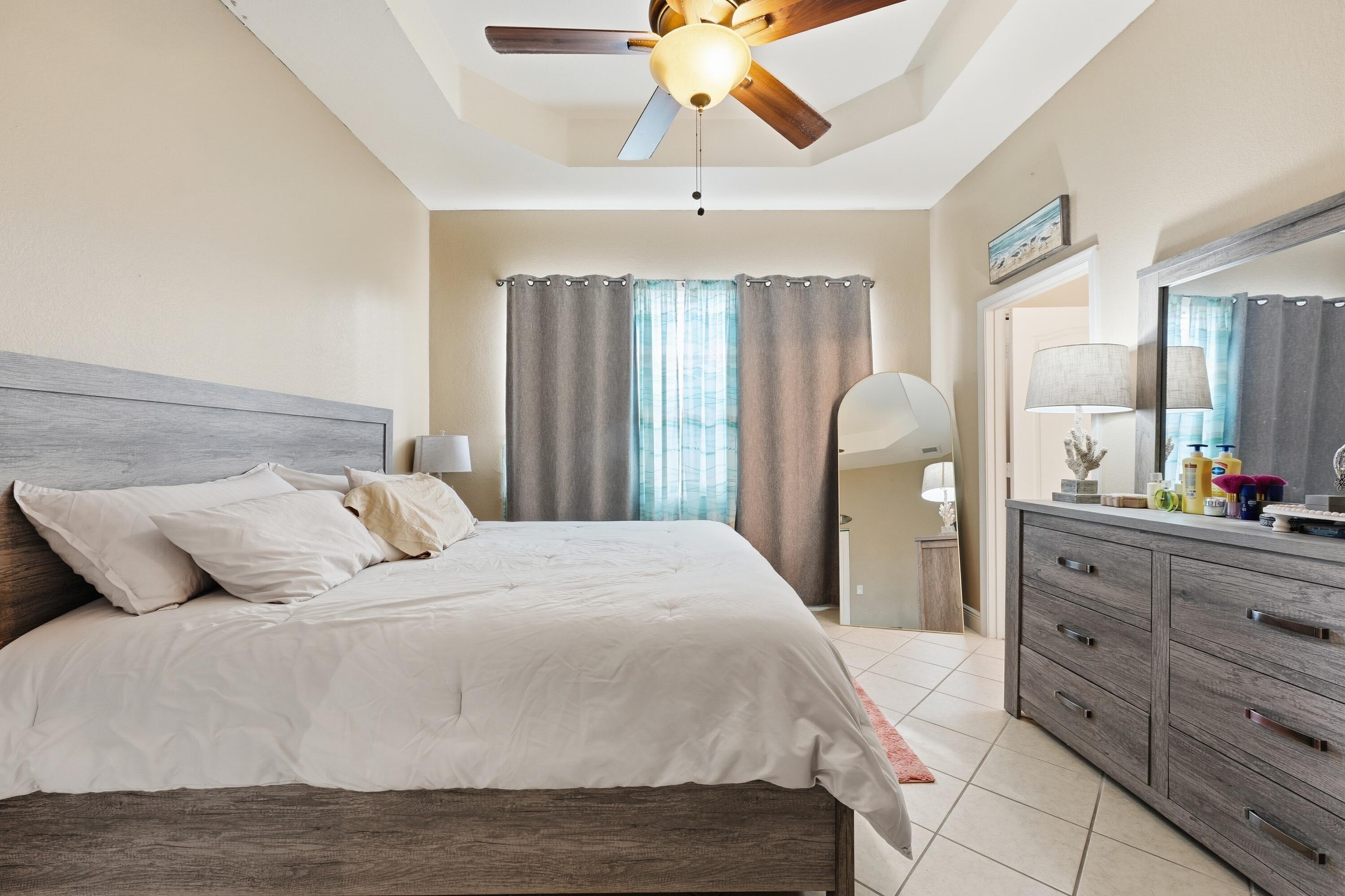 6117 Spring Lake Terrace Fort Pierce, FL 34951 - Photo 20 of 38 a bedroom with a bed and a dresser