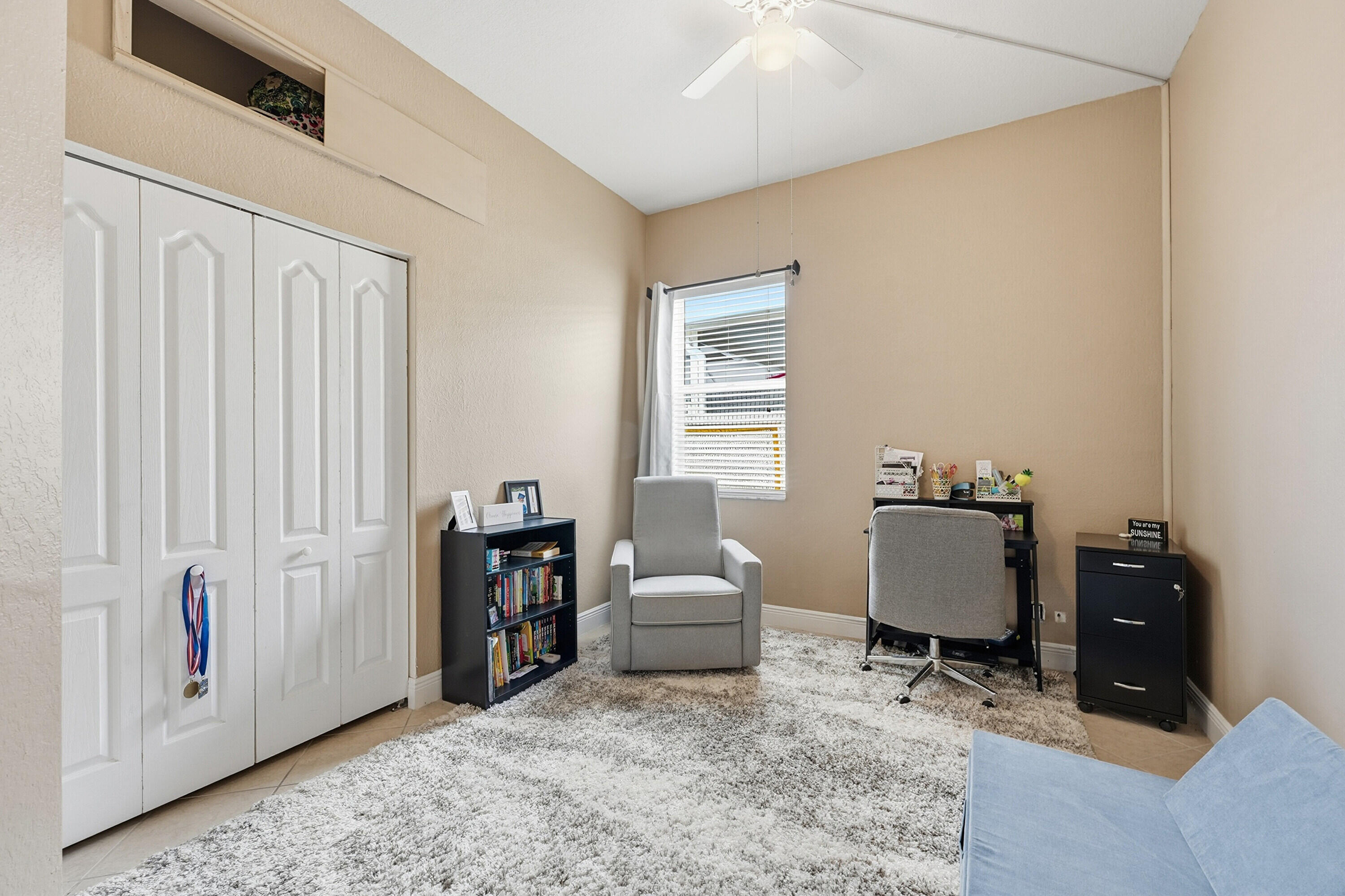 6117 Spring Lake Terrace Fort Pierce, FL 34951 - Photo 24 of 38 a living room with furniture and a window