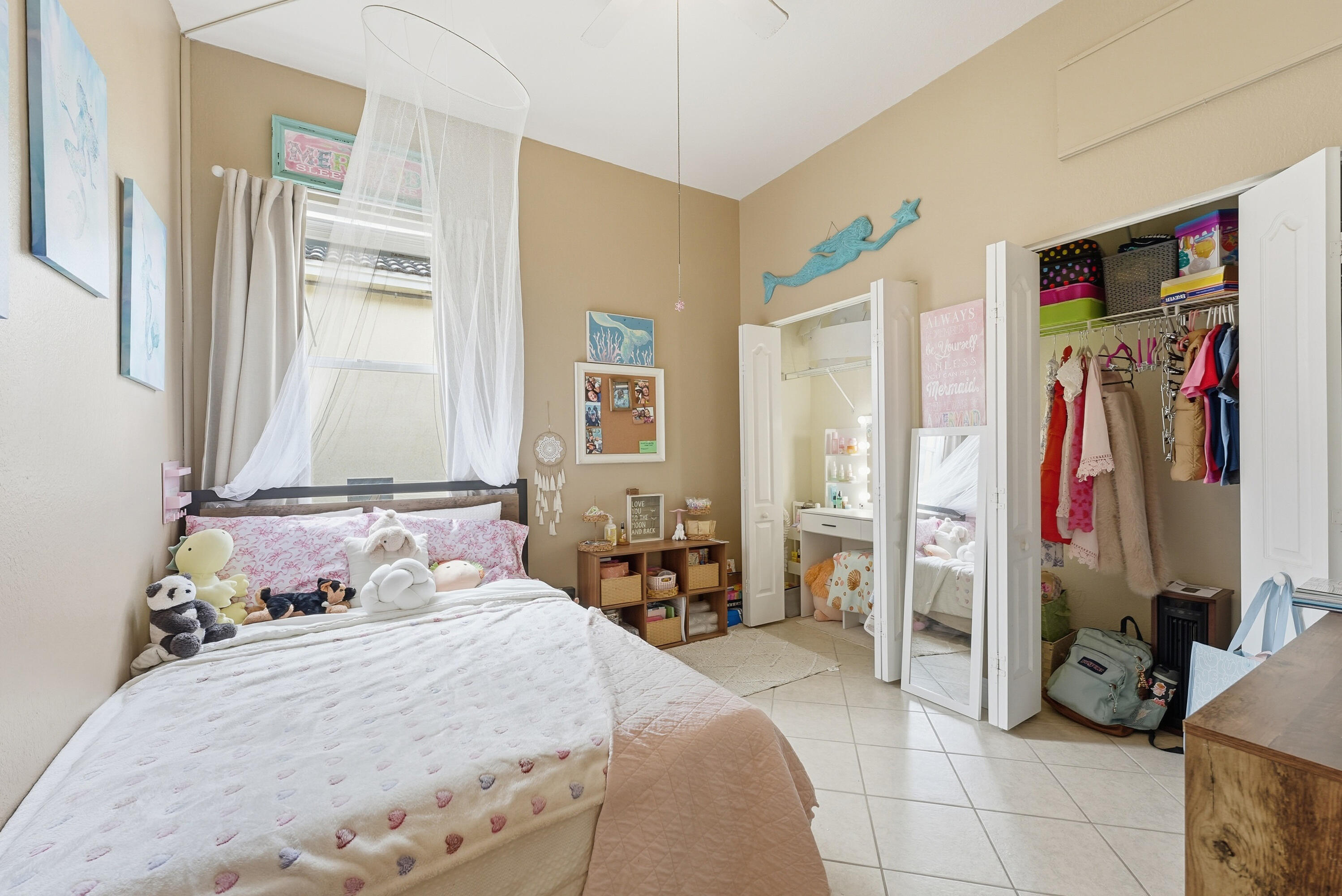 6117 Spring Lake Terrace Fort Pierce, FL 34951 - Photo 28 of 38 a bedroom with a bed and a window