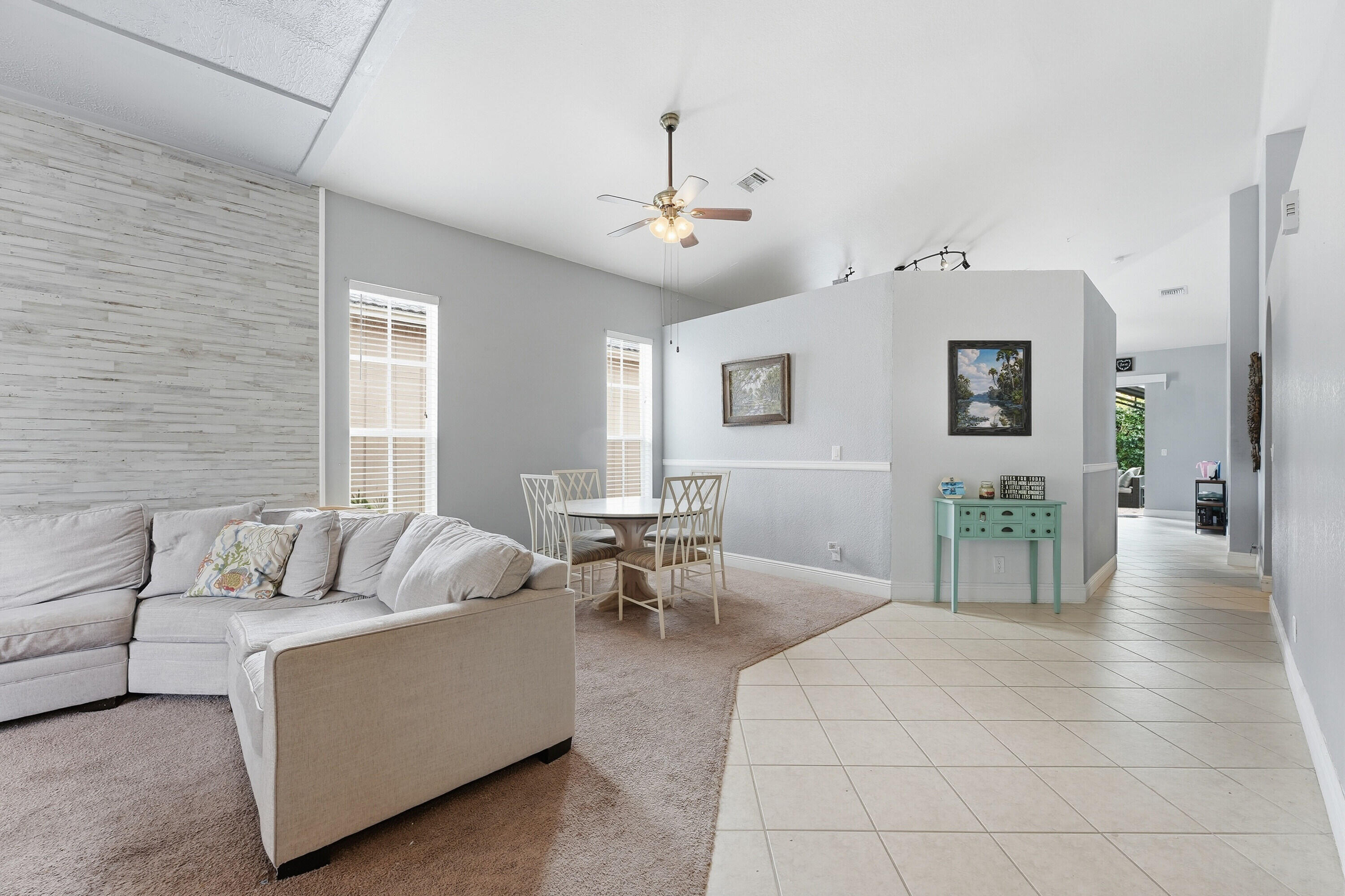 6117 Spring Lake Terrace Fort Pierce, FL 34951 - Photo 6 of 38 a living room with furniture and large windows