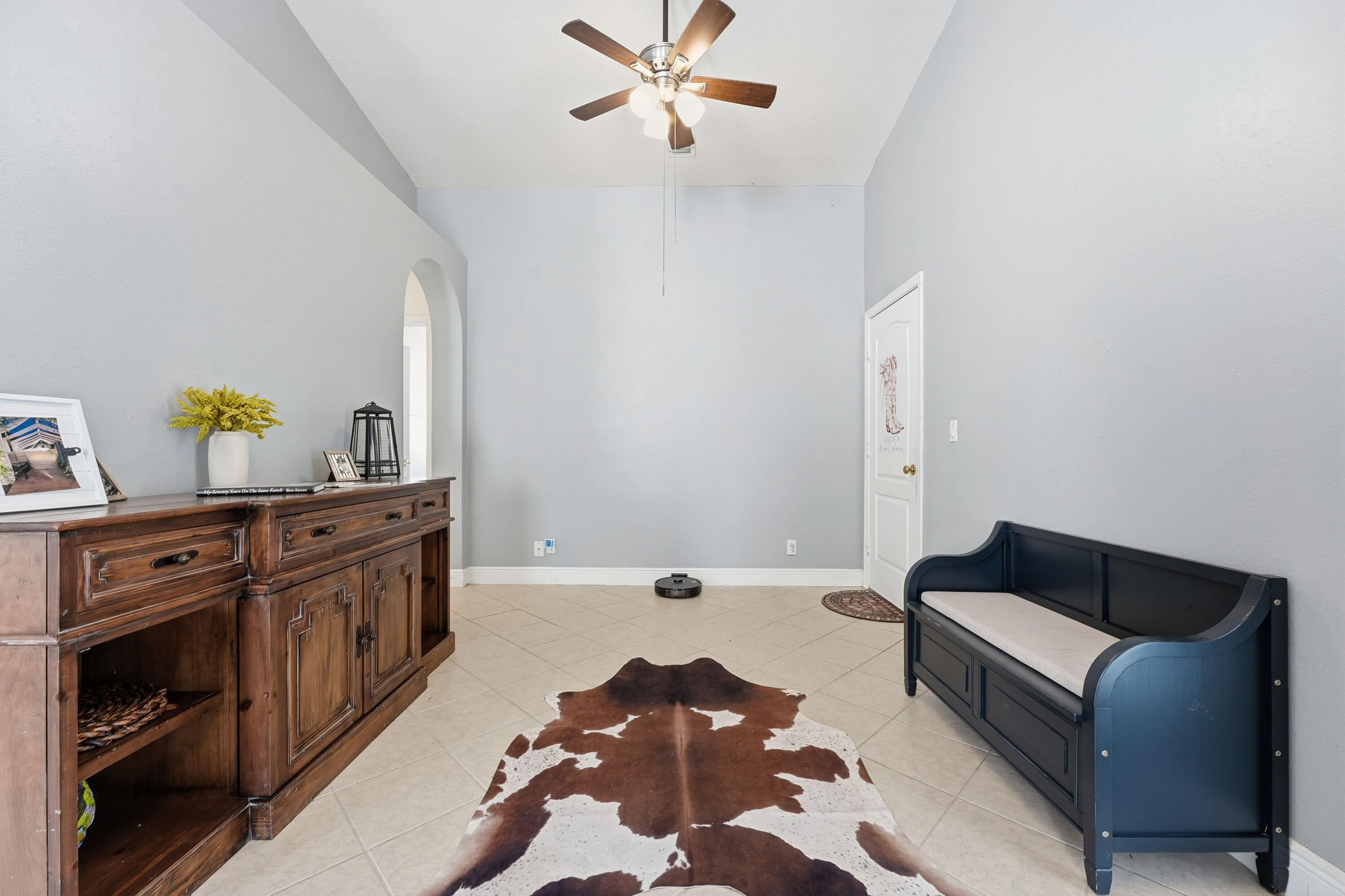 6117 Spring Lake Terrace Fort Pierce, FL 34951 - Photo 9 of 38 a spacious bedroom with a bed and ceiling fan