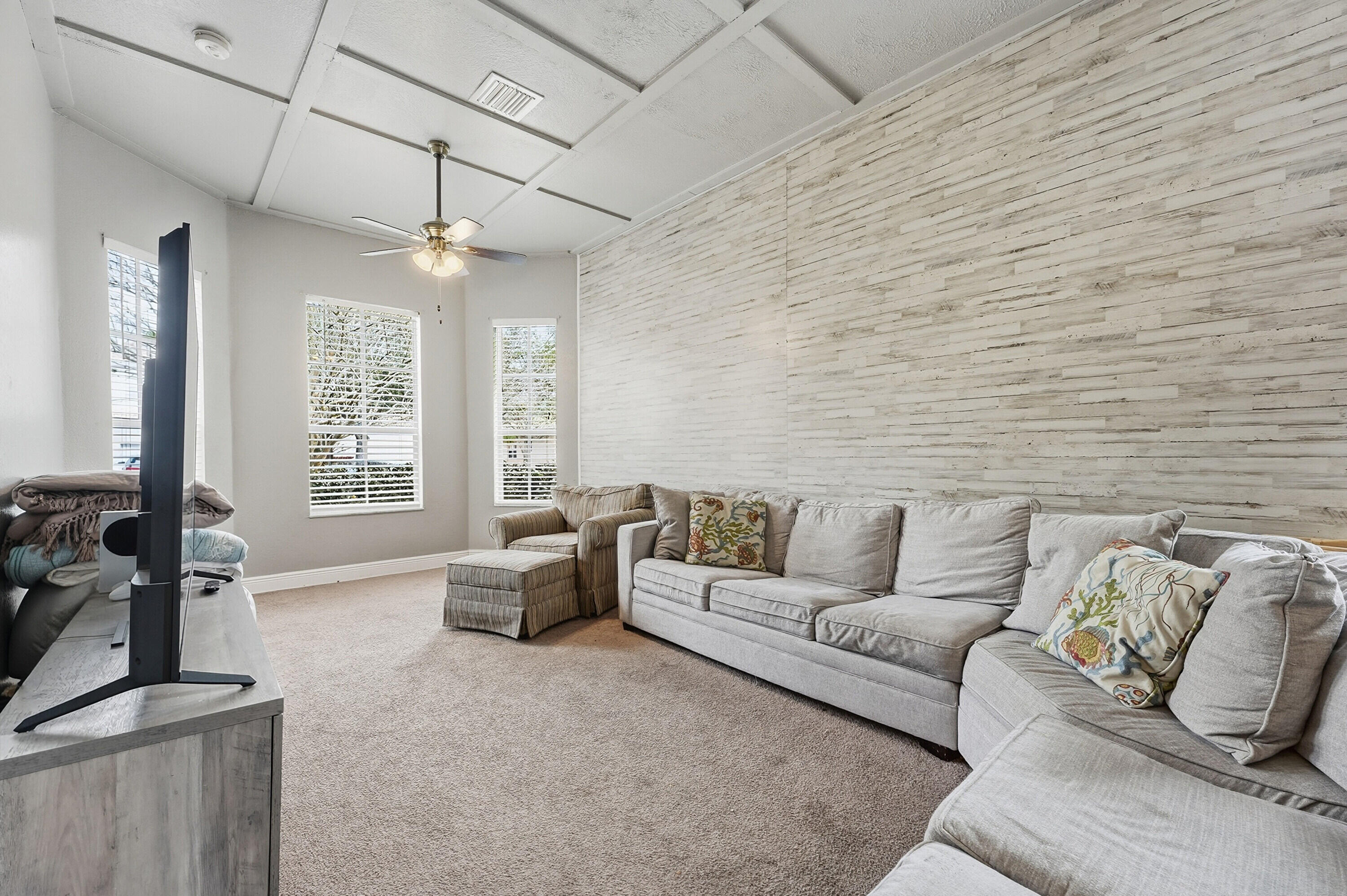 6117 Spring Lake Terrace Fort Pierce, FL 34951 - Photo 10 of 38 a living room with furniture and flat screen tv