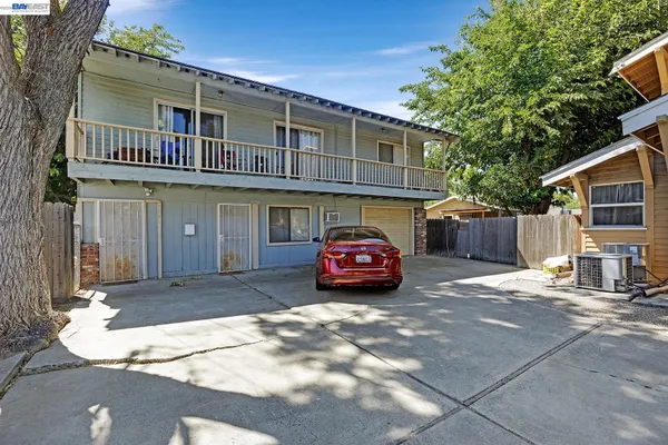 a view of a car park in front of house