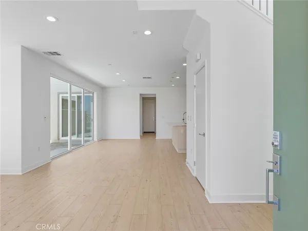 a view of a hallway with an entryway
