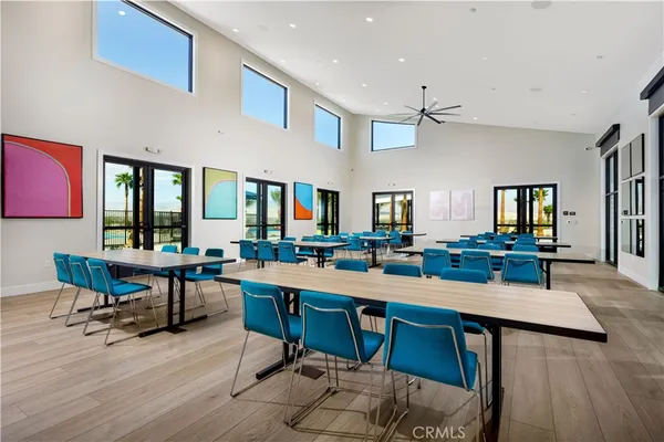 a room with lots of wooden furniture table and chairs