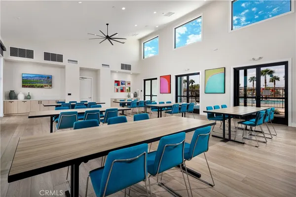 a view of a swimming pool with a table and chairs