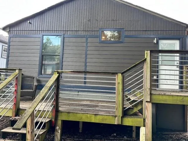 a view of a balcony with door and wooden floor