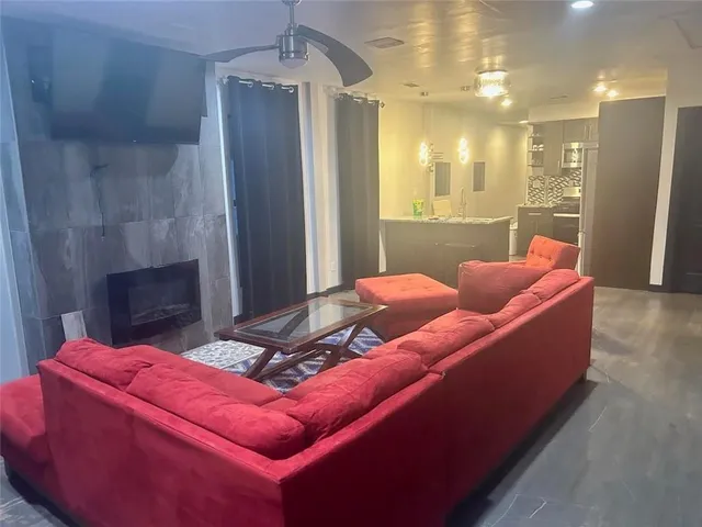 a projector room with furniture and a chandelier