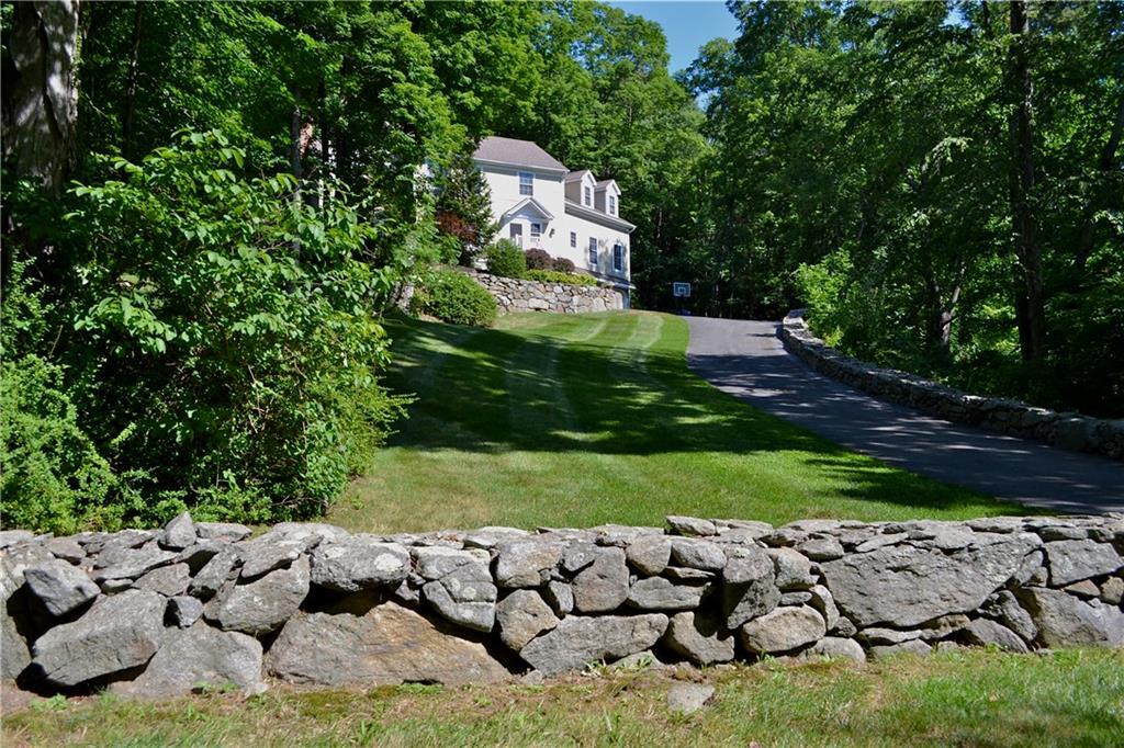54 River Ford Road Brookfield, CT 06804 - Photo 1 of 1 a view of a wooden house with a yard