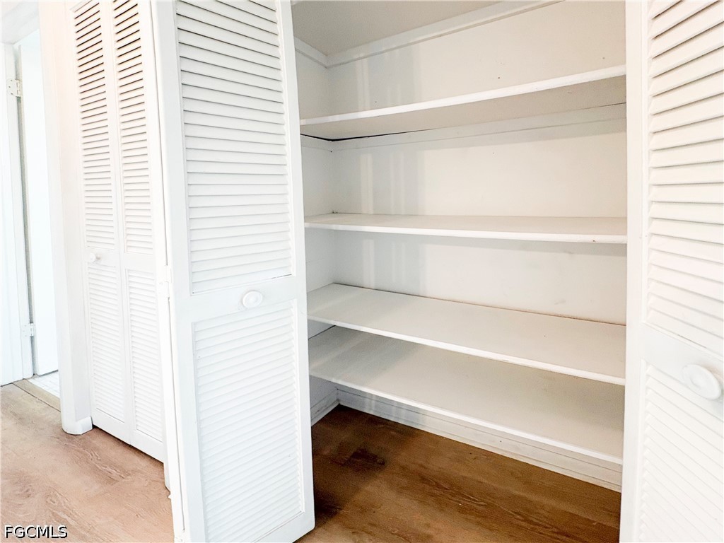 1830 Brantley Road, Unit I7 Fort Myers, FL 33907 - Photo 23 of 34 a view of walk in closet with empty racks