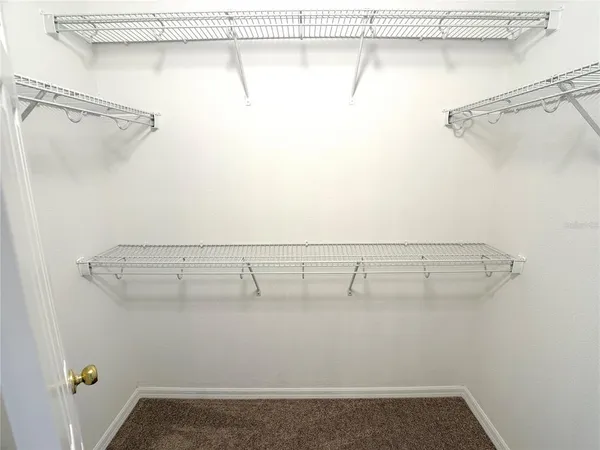 a view of a room with racks on the wall