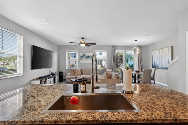 a living room with fireplace furniture and a flat screen tv