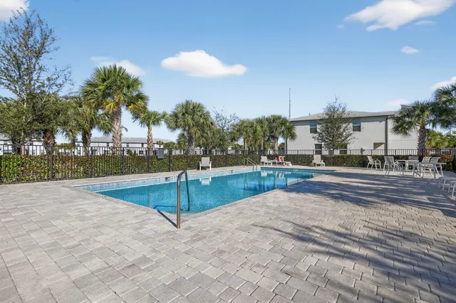 a view of a swimming pool with a yard