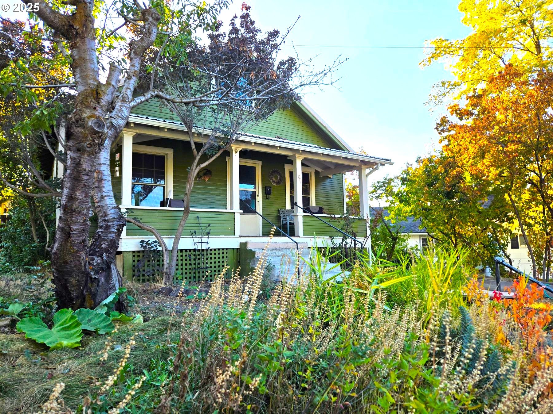 100 Southeast Hillcrest Road John Day, OR 97845 - Photo 1 of 30 a front view of a house with a garden