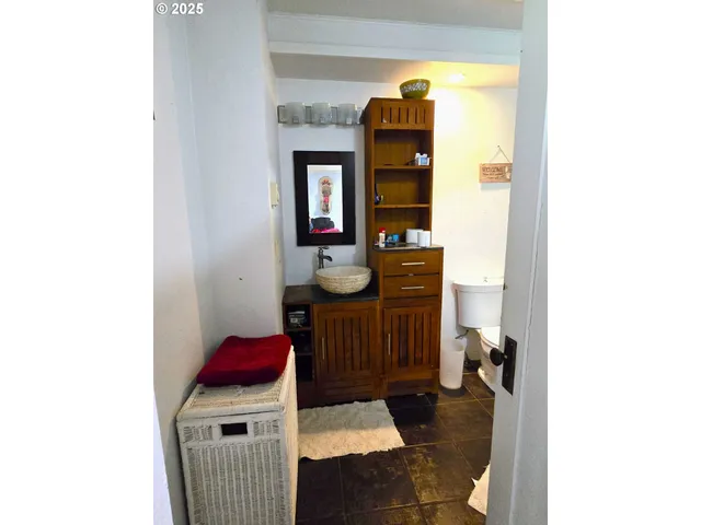 a bathroom with a toilet and a shower curtain