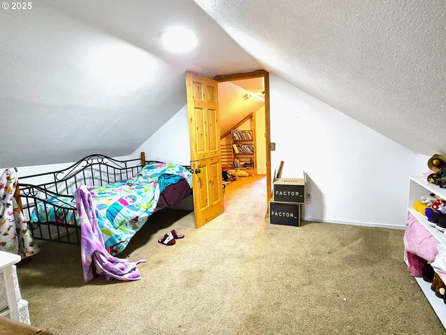 a bed room with a bed and a window