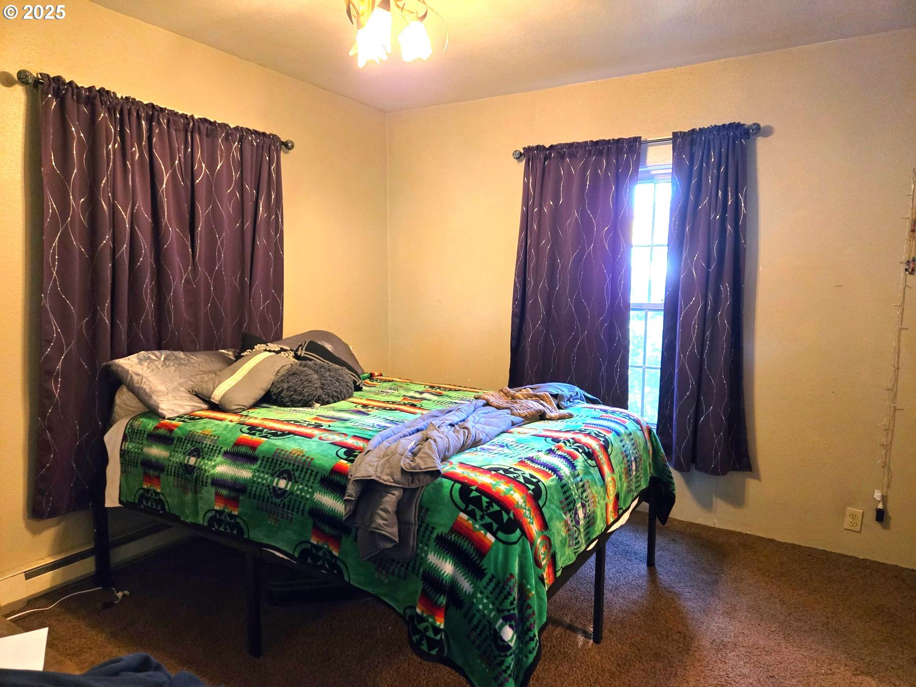 100 Southeast Hillcrest Road John Day, OR 97845 - Photo 24 of 30 a bedroom with a bed and a window