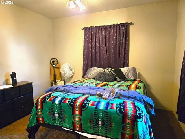 a kitchen with granite countertop a refrigerator and a stove