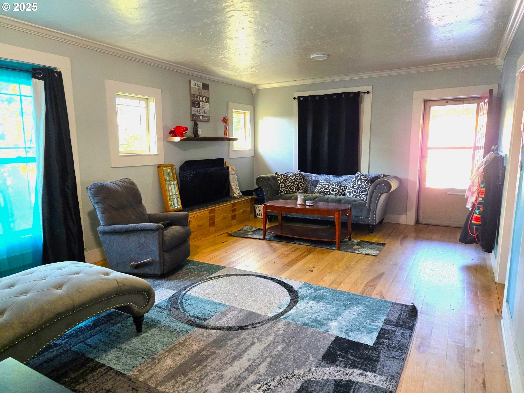 100 Southeast Hillcrest Road John Day, OR 97845 - Photo 29 of 30 a living room with furniture and a flat screen tv