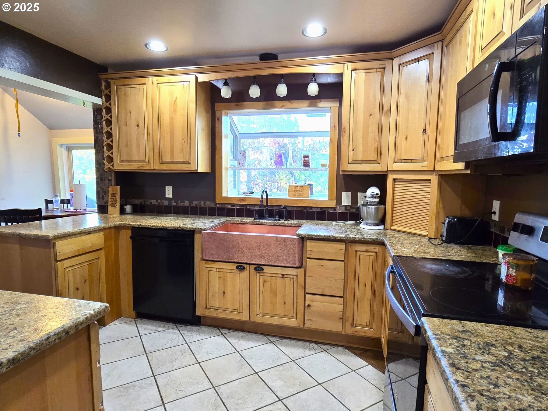 100 Southeast Hillcrest Road John Day, OR 97845 - Photo 4 of 30 a kitchen with a sink stove and microwave