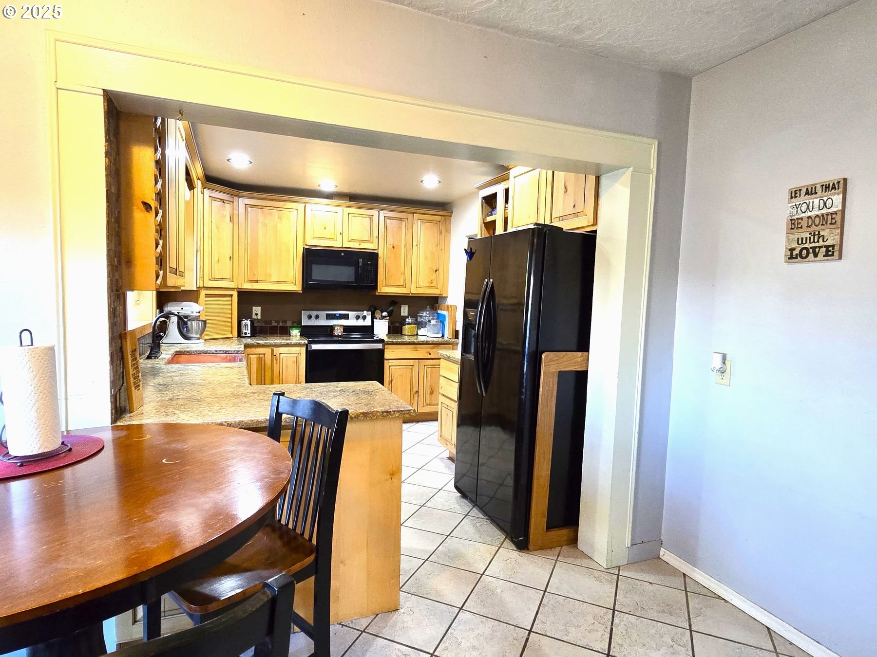 100 Southeast Hillcrest Road John Day, OR 97845 - Photo 6 of 30 a kitchen with stainless steel appliances granite countertop a refrigerator and a stove top oven