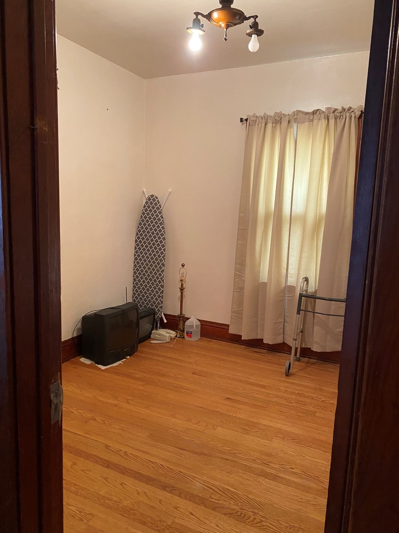 3112 Chicago Road Steger, IL 60475 - Photo 11 of 15 a view of a room with a window and a rug