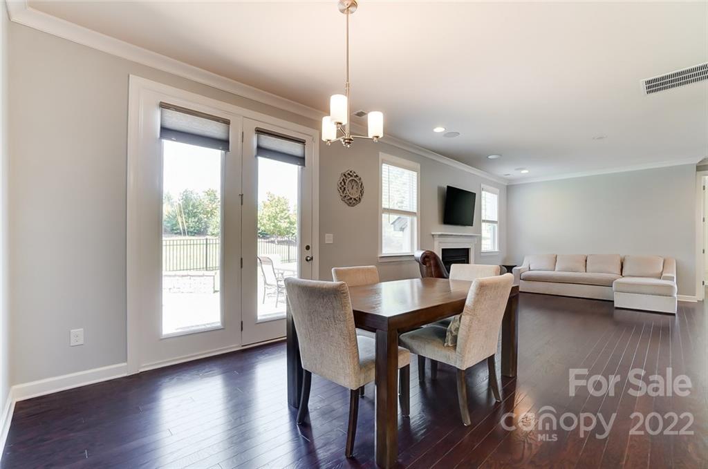 421 Sandbar Point Lake Wylie, SC 29710 - Photo 15 of 48 a view of a dining room with furniture window and wooden floor
