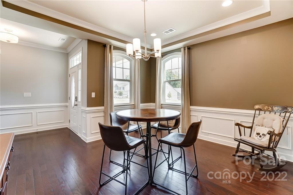 421 Sandbar Point Lake Wylie, SC 29710 - Photo 18 of 48 a view of a dining room with furniture window and wooden floor