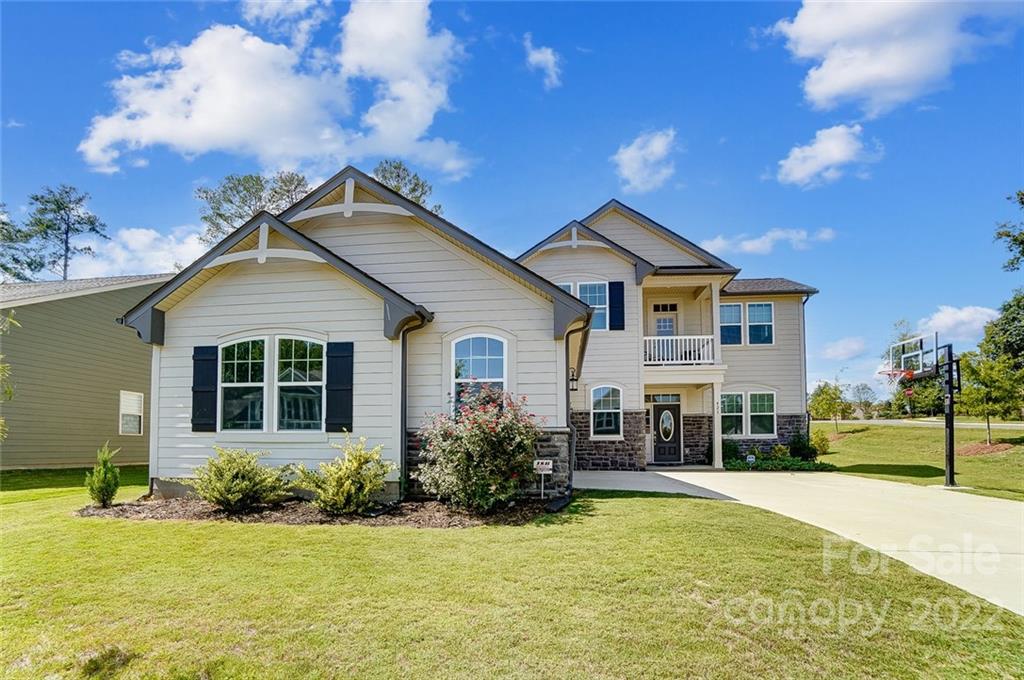 421 Sandbar Point Lake Wylie, SC 29710 - Photo 2 of 48 a front view of a house with a yard