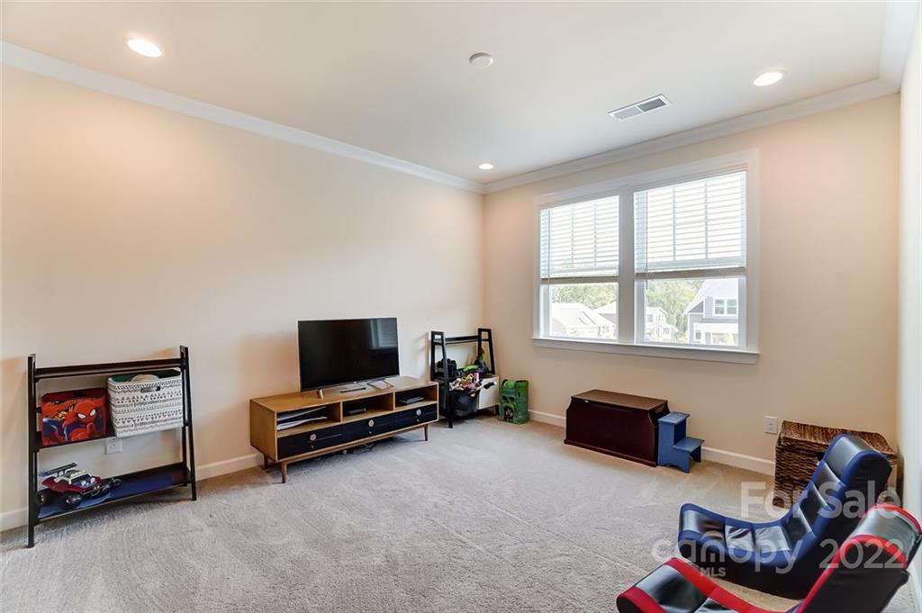 421 Sandbar Point Lake Wylie, SC 29710 - Photo 26 of 48 a living room with furniture gym equipment and a window