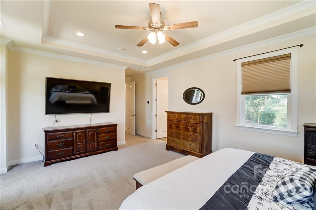 421 Sandbar Point Lake Wylie, SC 29710 - Photo 30 of 48 a bedroom with a bed and a flat screen tv