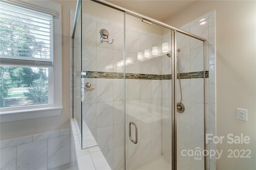 421 Sandbar Point Lake Wylie, SC 29710 - Photo 34 of 48 a bathroom with a glass shower door