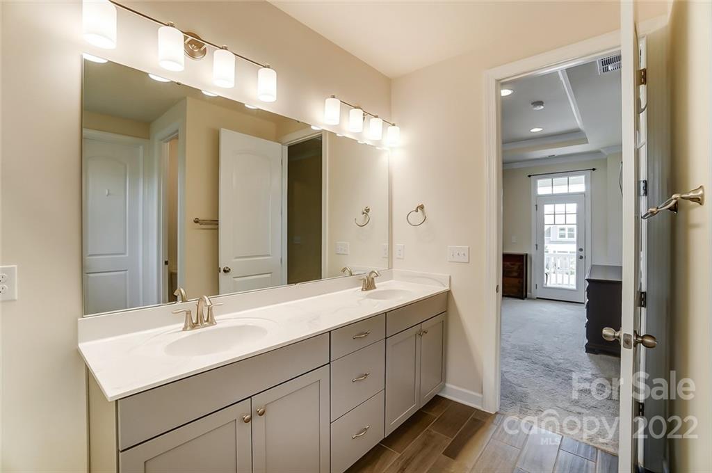 421 Sandbar Point Lake Wylie, SC 29710 - Photo 36 of 48 a bathroom with a double vanity sink and a mirror