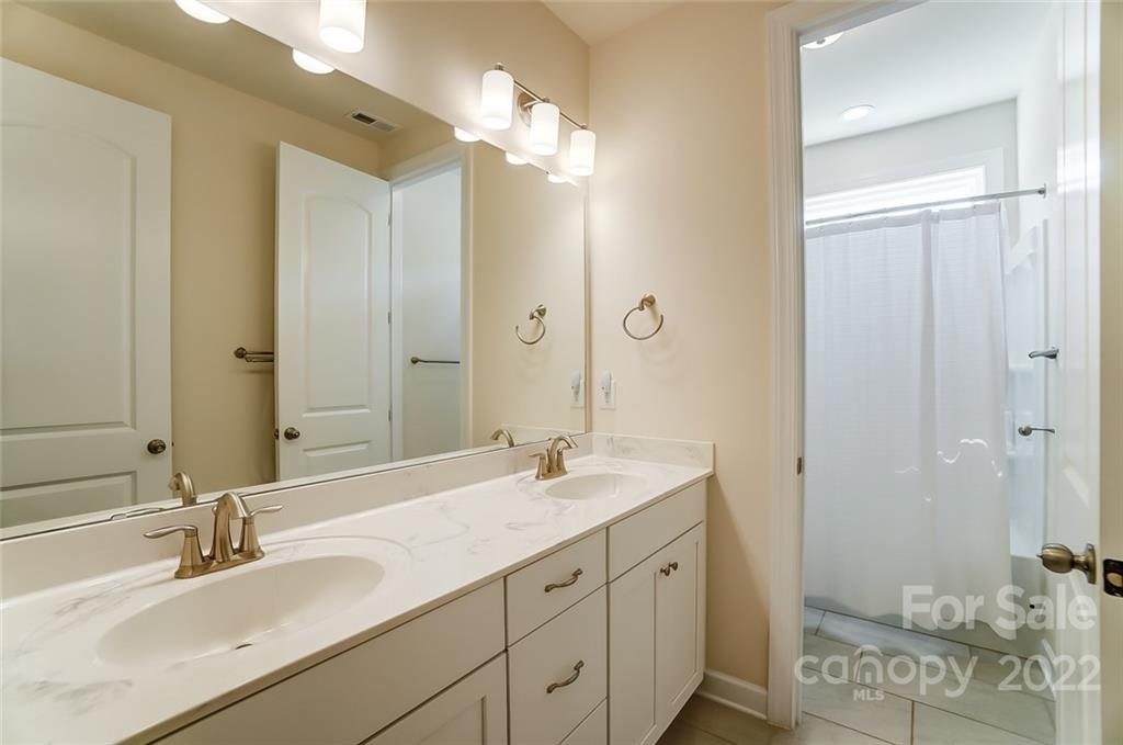 421 Sandbar Point Lake Wylie, SC 29710 - Photo 39 of 48 a bathroom with double vanity sink and a mirror